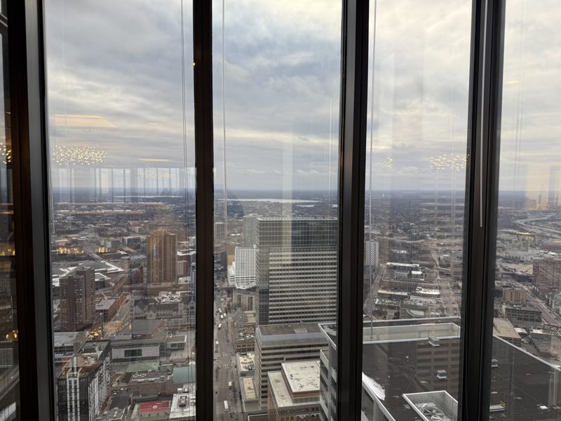 The Minneapolis skyline and surrounding city seen through a tower window on a hazy winter day